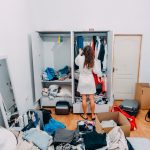 lady inside cluttered apartment