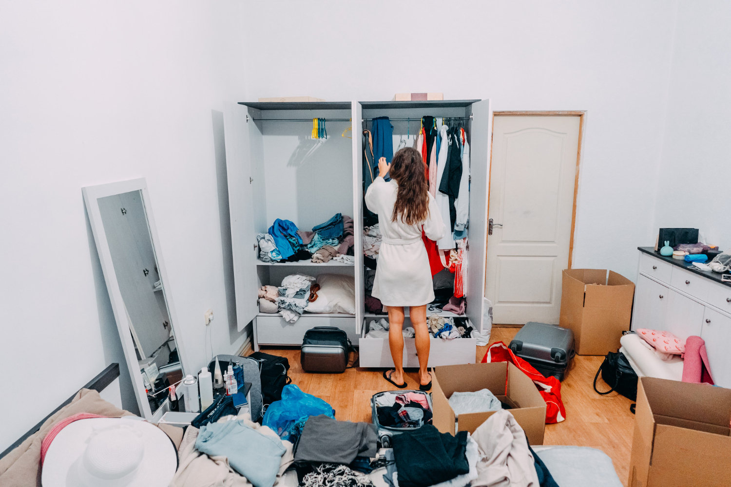 lady inside cluttered apartment