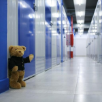 Teddy bear in storage hallway